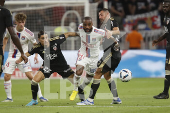 05/08/2022 - Alexandre LACAZETTE of Lyon and Kevin SPADANUDA of Ajaccio and Thomas MANGANI of Ajaccio during the French championship Ligue 1 football match between Olympique Lyonnais (Lyon) and AC Ajaccio on August 5, 2022 at Groupama stadium in Decines-Charpieu near Lyon, France - FOOTBALL - FRENCH CHAMP - LYON V AJACCIO - FRENCH LIGUE 1 - CALCIO