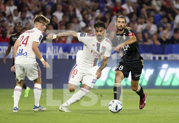 05/08/2022 - Lucas Paqueta of Lyon, Vincent Marchetti of Ajaccio, left Johann Lepenant of Lyon during the French championship Ligue 1 football match between Olympique Lyonnais (OL) and AC Ajaccio (ACA) on August 5, 2022 at Groupama Stadium in Decines-Charpieu near Lyon, France - FOOTBALL - FRENCH CHAMP - LYON V AJACCIO - FRENCH LIGUE 1 - CALCIO