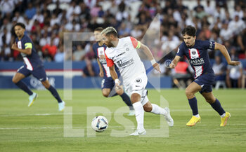 13/08/2022 - Teji Savanier of Montpellier, Vitinha of PSG during the French championship Ligue 1 football match between Paris Saint-Germain (PSG) and Montpellier HSC (MHSC) on August 13, 2022 at Parc des Princes stadium in Paris, France - FOOTBALL - FRENCH CHAMP - PARIS SG V MONTPELLIER - FRENCH LIGUE 1 - CALCIO