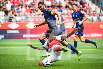 14/08/2022 - Florent OGIER of Clermont and Folarin BALOGUN of Reims during the French championship Ligue 1 football match between Stade de Reims and Clermont Foot 63 on August 14, 2022 at Auguste Delaune stadium in Reims, France - FOOTBALL - FRENCH CHAMP - REIMS V CLERMONT - FRENCH LIGUE 1 - CALCIO