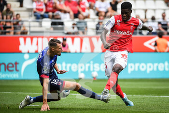 14/08/2022 - Elbasan RASHANI of Clermont and Marshall MUNETSI of Reims during the French championship Ligue 1 football match between Stade de Reims and Clermont Foot 63 on August 14, 2022 at Auguste Delaune stadium in Reims, France - FOOTBALL - FRENCH CHAMP - REIMS V CLERMONT - FRENCH LIGUE 1 - CALCIO