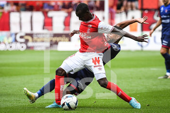 14/08/2022 - Kamory DOUMBIA of Reims and Jim ALLEVINAH of Clermont during the French championship Ligue 1 football match between Stade de Reims and Clermont Foot 63 on August 14, 2022 at Auguste Delaune stadium in Reims, France - FOOTBALL - FRENCH CHAMP - REIMS V CLERMONT - FRENCH LIGUE 1 - CALCIO