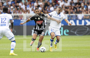 14/08/2022 - Nabil Bentaleb of Angers, Hamza Sakhi of Auxerre during the French championship Ligue 1 football match between AJ Auxerre (AJA) and Angers SCO on August 14, 2022 at Stade Abbe Deschamps in Auxerre, France - FOOTBALL - FRENCH CHAMP - AUXERRE V ANGERS - FRENCH LIGUE 1 - CALCIO