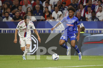 2022-08-19 - Wilson ODOBERT of Troyes and Nicolas TAGLIAFICO of Lyon during the French championship Ligue 1 football match between Olympique Lyonnais (Lyon) and ESTAC Troyes on August 19, 2022 at Groupama stadium in Decines-Charpieu near Lyon, France - FOOTBALL - FRENCH CHAMP - LYON V TROYES - FRENCH LIGUE 1 - SOCCER