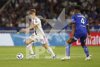 2022-08-19 - Johann LEPENANT of Lyon and Erik PALMER-BROWN of Troyes during the French championship Ligue 1 football match between Olympique Lyonnais (Lyon) and ESTAC Troyes on August 19, 2022 at Groupama stadium in Decines-Charpieu near Lyon, France - FOOTBALL - FRENCH CHAMP - LYON V TROYES - FRENCH LIGUE 1 - SOCCER