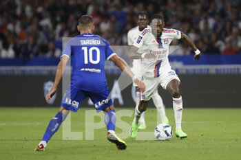 2022-08-19 - Karl TOKO EKAMBI of Lyon and Florian TARDIEU of Troyes during the French championship Ligue 1 football match between Olympique Lyonnais (Lyon) and ESTAC Troyes on August 19, 2022 at Groupama stadium in Decines-Charpieu near Lyon, France - FOOTBALL - FRENCH CHAMP - LYON V TROYES - FRENCH LIGUE 1 - SOCCER