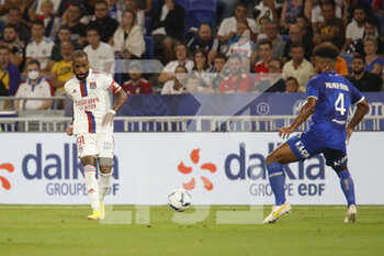 2022-08-19 - Alexandre LACAZETTE of Lyon and Erik PALMER-BROWN of Troyes during the French championship Ligue 1 football match between Olympique Lyonnais (Lyon) and ESTAC Troyes on August 19, 2022 at Groupama stadium in Decines-Charpieu near Lyon, France - FOOTBALL - FRENCH CHAMP - LYON V TROYES - FRENCH LIGUE 1 - SOCCER