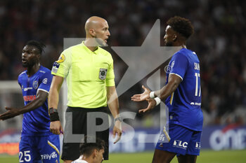 2022-08-19 - Referee Eric WATTELLIER and Yoann SALMIER of Troyes during the French championship Ligue 1 football match between Olympique Lyonnais (Lyon) and ESTAC Troyes on August 19, 2022 at Groupama stadium in Decines-Charpieu near Lyon, France - FOOTBALL - FRENCH CHAMP - LYON V TROYES - FRENCH LIGUE 1 - SOCCER