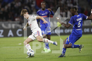 2022-08-19 - Johann LEPENANT of Lyon and N’Guessan KOUAME of Troyes during the French championship Ligue 1 football match between Olympique Lyonnais (Lyon) and ESTAC Troyes on August 19, 2022 at Groupama stadium in Decines-Charpieu near Lyon, France - FOOTBALL - FRENCH CHAMP - LYON V TROYES - FRENCH LIGUE 1 - SOCCER