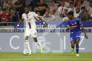 2022-08-19 - Karl TOKO EKAMBI of Lyon and Thierno BALDE of Troyes during the French championship Ligue 1 football match between Olympique Lyonnais (Lyon) and ESTAC Troyes on August 19, 2022 at Groupama stadium in Decines-Charpieu near Lyon, France - FOOTBALL - FRENCH CHAMP - LYON V TROYES - FRENCH LIGUE 1 - SOCCER
