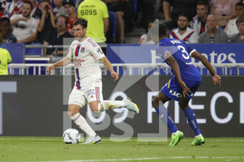 2022-08-19 - Nicolas TAGLIAFICO of Lyon and Thierno BALDE of Troyes during the French championship Ligue 1 football match between Olympique Lyonnais (Lyon) and ESTAC Troyes on August 19, 2022 at Groupama stadium in Decines-Charpieu near Lyon, France - FOOTBALL - FRENCH CHAMP - LYON V TROYES - FRENCH LIGUE 1 - SOCCER