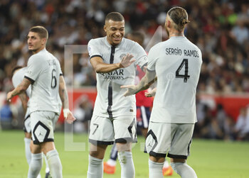 2022-08-21 - Kylian Mbappe, Sergio Ramos of PSG celebrate a goal during the French championship Ligue 1 football match between LOSC Lille and Paris Saint-Germain on August 21, 2022 at Stade Pierre Mauroy in Villeneuve-d'Ascq near Lille, France - FOOTBALL - FRENCH CHAMP - LILLE V PARIS SG - FRENCH LIGUE 1 - SOCCER
