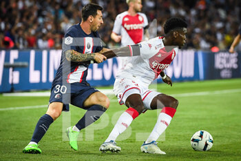2022-08-28 - Lionel (Leo) MESSI of PSG and Benoit BADIASHILE of Monaco during the French championship Ligue 1 football match between Paris Saint-Germain and AS Monaco on August 28, 2022 at Parc des Princes stadium in Paris, France - FOOTBALL - FRENCH CHAMP - PARIS SG V MONACO - FRENCH LIGUE 1 - SOCCER