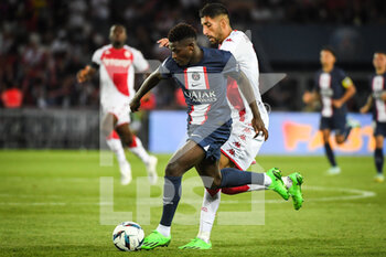 2022-08-28 - Nuno MENDES of PSG and Benoit BADIASHILE of Monaco during the French championship Ligue 1 football match between Paris Saint-Germain and AS Monaco on August 28, 2022 at Parc des Princes stadium in Paris, France - FOOTBALL - FRENCH CHAMP - PARIS SG V MONACO - FRENCH LIGUE 1 - SOCCER