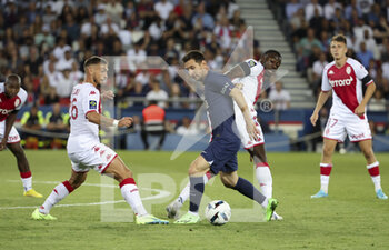 2022-08-28 - Lionel Messi of PSG, Youssouf Fofana of Monaco, left Ruben Aguilar of Monaco during the French championship Ligue 1 football match between Paris Saint-Germain (PSG) and AS Monaco (ASM) on August 28, 2022 at Parc des Princes stadium in Paris, France - FOOTBALL - FRENCH CHAMP - PARIS SG V MONACO - FRENCH LIGUE 1 - SOCCER