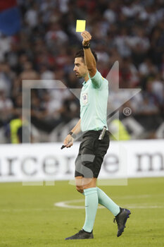 31/08/2022 - Referee Pierre GAILLOUSTE yellow card during the French championship Ligue 1 football match between Olympique Lyonnais (Lyon) and AJ Auxerre on August 31, 2022 at Groupama stadium in Decines-Charpieu near Lyon, France - FOOTBALL - FRENCH CHAMP - LYON V AUXERRE - FRENCH LIGUE 1 - CALCIO