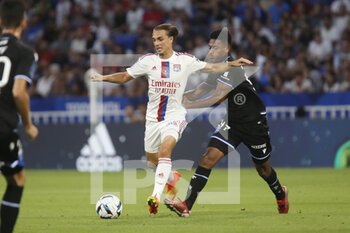 31/08/2022 - Maxence CAQUERET of Lyon and Rayan RAVELOSON of Auxerre during the French championship Ligue 1 football match between Olympique Lyonnais (Lyon) and AJ Auxerre on August 31, 2022 at Groupama stadium in Decines-Charpieu near Lyon, France - FOOTBALL - FRENCH CHAMP - LYON V AUXERRE - FRENCH LIGUE 1 - CALCIO