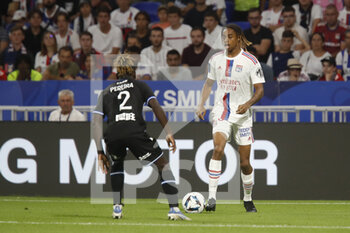 31/08/2022 - Bradley BARCOLA of Lyon and Brayann PEREIRA of Auxerre during the French championship Ligue 1 football match between Olympique Lyonnais (Lyon) and AJ Auxerre on August 31, 2022 at Groupama stadium in Decines-Charpieu near Lyon, France - FOOTBALL - FRENCH CHAMP - LYON V AUXERRE - FRENCH LIGUE 1 - CALCIO