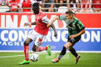 2022-09-04 - Banzouzi (Bradley) LOCKO of Reims and Przemyslaw Adam FRANKOWSKI of Lens during the French championship Ligue 1 football match between Stade de Reims and RC Lens on September 4, 2022 at Auguste Delaune stadium in Reims, France - FOOTBALL - FRENCH CHAMP - REIMS V LENS - FRENCH LIGUE 1 - SOCCER