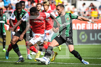 2022-09-04 - Kevin DANSO of Lens, Folarin BALOGUN of Reims and Jonathan GRADIT of Lens during the French championship Ligue 1 football match between Stade de Reims and RC Lens on September 4, 2022 at Auguste Delaune stadium in Reims, France - FOOTBALL - FRENCH CHAMP - REIMS V LENS - FRENCH LIGUE 1 - SOCCER