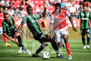2022-09-04 - Kevin DANSO of Lens and Marshall MUNETSI of Reims during the French championship Ligue 1 football match between Stade de Reims and RC Lens on September 4, 2022 at Auguste Delaune stadium in Reims, France - FOOTBALL - FRENCH CHAMP - REIMS V LENS - FRENCH LIGUE 1 - SOCCER
