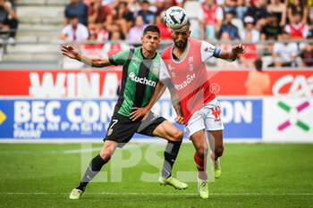 2022-09-04 - Florian SOTOCA of Lens and Yunis ABDELHAMID of Reims during the French championship Ligue 1 football match between Stade de Reims and RC Lens on September 4, 2022 at Auguste Delaune stadium in Reims, France - FOOTBALL - FRENCH CHAMP - REIMS V LENS - FRENCH LIGUE 1 - SOCCER