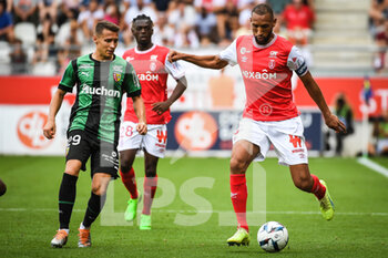 2022-09-04 - Przemyslaw Adam FRANKOWSKI of Lens and Yunis ABDELHAMID of Reims during the French championship Ligue 1 football match between Stade de Reims and RC Lens on September 4, 2022 at Auguste Delaune stadium in Reims, France - FOOTBALL - FRENCH CHAMP - REIMS V LENS - FRENCH LIGUE 1 - SOCCER