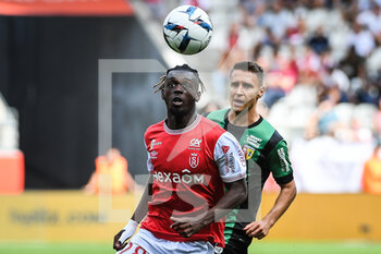 2022-09-04 - Banzouzi (Bradley) LOCKO of Reims and Przemyslaw Adam FRANKOWSKI of Lens during the French championship Ligue 1 football match between Stade de Reims and RC Lens on September 4, 2022 at Auguste Delaune stadium in Reims, France - FOOTBALL - FRENCH CHAMP - REIMS V LENS - FRENCH LIGUE 1 - SOCCER