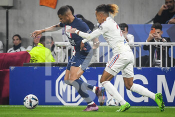 2022-09-18 - Kylian MBAPPE of PSG and Malo GUSTO of Lyon during the French championship Ligue 1 football match between Olympique Lyonnais and Paris Saint-Germain on September 18, 2022 at Groupama Stadium in Decines-Charpieu near Lyon, France - FOOTBALL - FRENCH CHAMP - LYON V PSG - FRENCH LIGUE 1 - SOCCER
