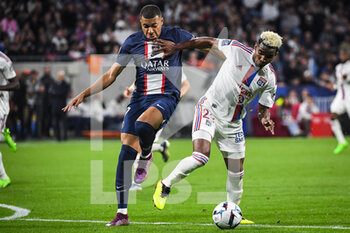 2022-09-18 - Kylian MBAPPE of PSG and Thiago MENDES of Lyon during the French championship Ligue 1 football match between Olympique Lyonnais and Paris Saint-Germain on September 18, 2022 at Groupama Stadium in Decines-Charpieu near Lyon, France - FOOTBALL - FRENCH CHAMP - LYON V PSG - FRENCH LIGUE 1 - SOCCER