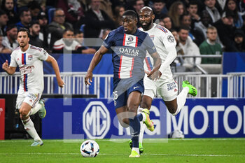 18/09/2022 - Nordi MUKIELE of PSG and Moussa DEMBELE of Lyon during the French championship Ligue 1 football match between Olympique Lyonnais and Paris Saint-Germain on September 18, 2022 at Groupama Stadium in Decines-Charpieu near Lyon, France - FOOTBALL - FRENCH CHAMP - LYON V PSG - FRENCH LIGUE 1 - CALCIO