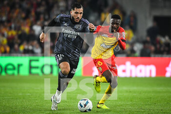 2022-10-02 - Rayan CHERKI of Lyon and Salis ABDUL SAMED of Lens during the French championship Ligue 1 football match between RC Lens and Olympique Lyonnais (Lyon) on October 2, 2022 at Bollaert-Delelis stadium in Lens, France - FOOTBALL - FRENCH CHAMP - LENS V LYON - FRENCH LIGUE 1 - SOCCER