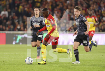 2022-10-02 - David Pereira Da Costa of Lens, Johann Lepenant of Lyon during the French championship Ligue 1 football match between RC Lens (RCL) and Olympique Lyonnais (OL, Lyon) on October 2, 2022 at Stade Bollaert-Delelis in Lens, France - FOOTBALL - FRENCH CHAMP - LENS V LYON - FRENCH LIGUE 1 - SOCCER