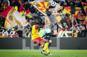 2022-10-02 - Seko FOFANA of Lens and Johann LEPENANT of Lyon during the French championship Ligue 1 football match between RC Lens and Olympique Lyonnais (Lyon) on October 2, 2022 at Bollaert-Delelis stadium in Lens, France - FOOTBALL - FRENCH CHAMP - LENS V LYON - FRENCH LIGUE 1 - SOCCER