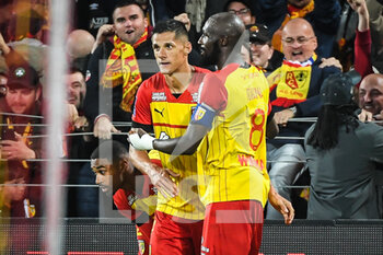 2022-10-02 - Florian SOTOCA of Lens celebrate his goal with Seko FOFANA of Lens during the French championship Ligue 1 football match between RC Lens and Olympique Lyonnais (Lyon) on October 2, 2022 at Bollaert-Delelis stadium in Lens, France - FOOTBALL - FRENCH CHAMP - LENS V LYON - FRENCH LIGUE 1 - SOCCER