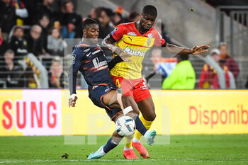 2022-10-15 - Lois OPENDA of Lens and Christopher JULLIEN of Montpellier during the French championship Ligue 1 football match between RC Lens and Montpellier HSC on October 15, 2022 at Bollaert-Delelis stadium in Lens, France - FOOTBALL - FRENCH CHAMP - LENS V MONTPELLIER - FRENCH LIGUE 1 - SOCCER