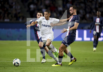 2022-10-16 - Amine Harit of Marseille between Marco Verratti and Fabian Ruiz Pena of PSG during the French championship Ligue 1 football match between Paris Saint-Germain (PSG) and Olympique de Marseille (OM) on October 16, 2022 at Parc des Princes stadium in Paris, France - FOOTBALL - FRENCH CHAMP - PARIS SG V MARSEILLE - FRENCH LIGUE 1 - SOCCER