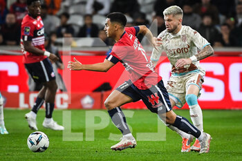 2022-10-23 - Adam OUNAS of Lille and Caio HENRIQUE of Monaco during the French championship Ligue 1 football match between LOSC Lille and AS Monaco on October 23, 2022 at Pierre Mauroy stadium in Villeneuve-d'Ascq near Lille, France - FOOTBALL - FRENCH CHAMP - LILLE V MONACO - FRENCH LIGUE 1 - SOCCER