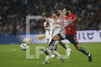 2022-10-30 - Andre TAVARES GOMES of Lille and Maxence CAQUERET of Lyon during the French championship Ligue 1 football match between Olympique Lyonnais (Lyon) and LOSC Lille on October 30, 2022 at Groupama stadium in Decines-Charpieu near Lyon, France - FOOTBALL - FRENCH CHAMP - LYON V LILLE - FRENCH LIGUE 1 - SOCCER