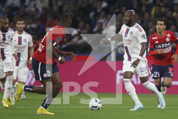 2022-10-30 - Moussa DEMBELE of Lyon and Tiago EMBALO DJALO of Lille during the French championship Ligue 1 football match between Olympique Lyonnais (Lyon) and LOSC Lille on October 30, 2022 at Groupama stadium in Decines-Charpieu near Lyon, France - FOOTBALL - FRENCH CHAMP - LYON V LILLE - FRENCH LIGUE 1 - SOCCER