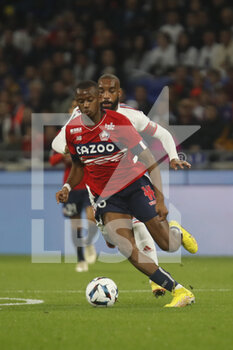 2022-10-30 - Tiago EMBALO DJALO of Lille and Alexandre LACAZETTE of Lyon during the French championship Ligue 1 football match between Olympique Lyonnais (Lyon) and LOSC Lille on October 30, 2022 at Groupama stadium in Decines-Charpieu near Lyon, France - FOOTBALL - FRENCH CHAMP - LYON V LILLE - FRENCH LIGUE 1 - SOCCER