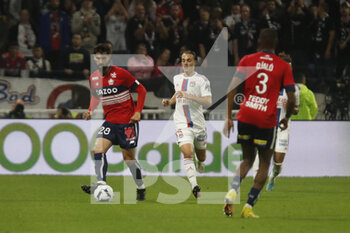2022-10-30 - Andre TAVARES GOMES of Lille and Maxence CAQUERET of Lyon during the French championship Ligue 1 football match between Olympique Lyonnais (Lyon) and LOSC Lille on October 30, 2022 at Groupama stadium in Decines-Charpieu near Lyon, France - FOOTBALL - FRENCH CHAMP - LYON V LILLE - FRENCH LIGUE 1 - SOCCER