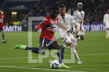 2022-10-30 - Jonathan BAMBA of Lille and Nicolas TAGLIAFICO of Lyon during the French championship Ligue 1 football match between Olympique Lyonnais (Lyon) and LOSC Lille on October 30, 2022 at Groupama stadium in Decines-Charpieu near Lyon, France - FOOTBALL - FRENCH CHAMP - LYON V LILLE - FRENCH LIGUE 1 - SOCCER