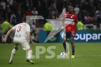 2022-10-30 - Tiago EMBALO DJALO of Lille and Nicolas TAGLIAFICO of Lyon during the French championship Ligue 1 football match between Olympique Lyonnais (Lyon) and LOSC Lille on October 30, 2022 at Groupama stadium in Decines-Charpieu near Lyon, France - FOOTBALL - FRENCH CHAMP - LYON V LILLE - FRENCH LIGUE 1 - SOCCER