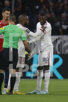 2022-10-30 - Alexandre LACAZETTE of Lyon and Karl TOKO EKAMBI of Lyon during the French championship Ligue 1 football match between Olympique Lyonnais (Lyon) and LOSC Lille on October 30, 2022 at Groupama stadium in Decines-Charpieu near Lyon, France - FOOTBALL - FRENCH CHAMP - LYON V LILLE - FRENCH LIGUE 1 - SOCCER