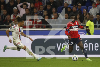 2022-10-30 - Jonathan BAMBA of Lille and Malo GUSTO of Lyon during the French championship Ligue 1 football match between Olympique Lyonnais (Lyon) and LOSC Lille on October 30, 2022 at Groupama stadium in Decines-Charpieu near Lyon, France - FOOTBALL - FRENCH CHAMP - LYON V LILLE - FRENCH LIGUE 1 - SOCCER