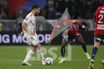 2022-10-30 - Rayan CHERKI of Lyon and Jonathan BAMBA of Lille during the French championship Ligue 1 football match between Olympique Lyonnais (Lyon) and LOSC Lille on October 30, 2022 at Groupama stadium in Decines-Charpieu near Lyon, France - FOOTBALL - FRENCH CHAMP - LYON V LILLE - FRENCH LIGUE 1 - SOCCER