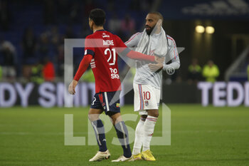 2022-10-30 - Alexandre LACAZETTE of Lyon and Benjamin ANDRE of Lille during the French championship Ligue 1 football match between Olympique Lyonnais (Lyon) and LOSC Lille on October 30, 2022 at Groupama stadium in Decines-Charpieu near Lyon, France - FOOTBALL - FRENCH CHAMP - LYON V LILLE - FRENCH LIGUE 1 - SOCCER