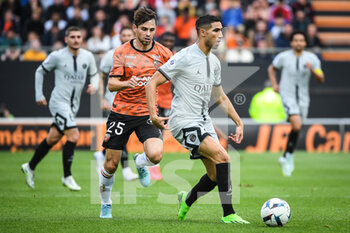2022-11-06 - Vincent LE GOFF of Lorient and Achraf HAKIMI of PSG during the French championship Ligue 1 football match between FC Lorient and Paris Saint-Germain on November 6, 2022 at the Moustoir stadium in Lorient, France - FOOTBALL - FRENCH CHAMP - LORIENT V PARIS SG - FRENCH LIGUE 1 - SOCCER