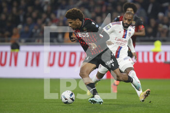 2022-11-11 - Jean-Clair TOBIDO of Nice and Alexandre LACAZETTE of Lyon during the French championship Ligue 1 football match between Olympique Lyonnais (Lyon) and OGC Nice on November 11, 2022 at Groupama stadium in Decines-Charpieu near Lyon, France - FOOTBALL - FRENCH CHAMP - LYON V NICE - FRENCH LIGUE 1 - SOCCER